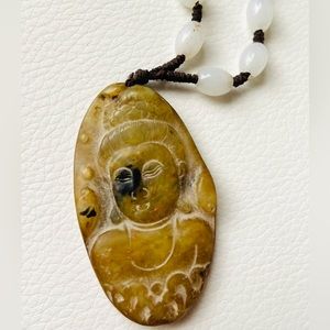 Hand carved jade Buddha pendant with hand strung jade beads on leather cord